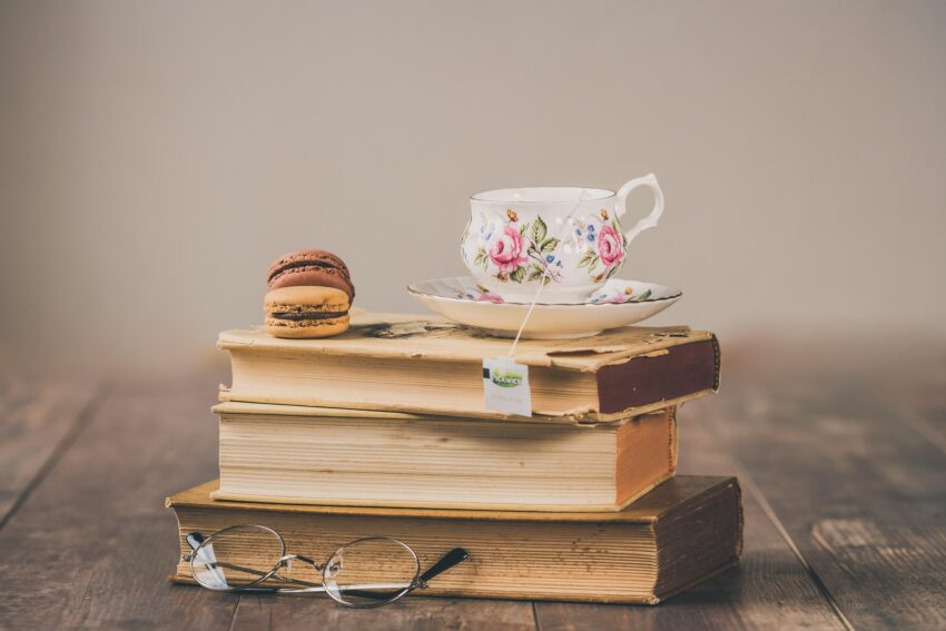 Image of a stack of books with teacup on taop