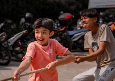 image of kids playing tug of war