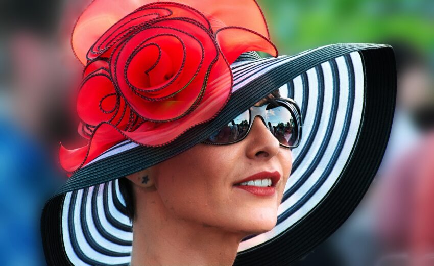 image of woman wearing black and white derby hat