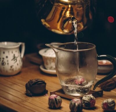 image of tea pouring from kettle to container