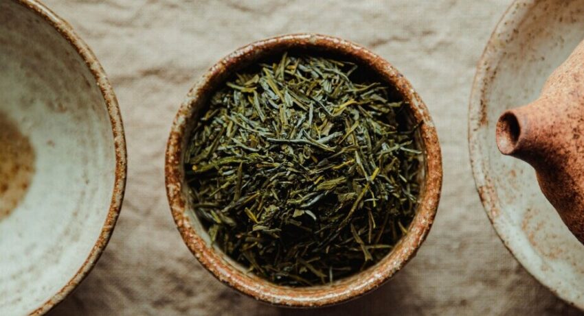 Image of cup fll of shredded herbs next to other empty bowls
