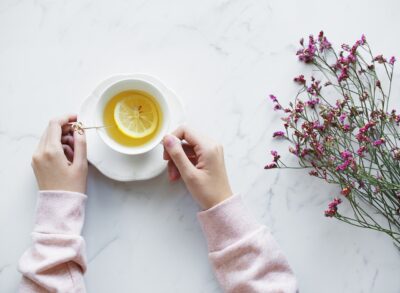 Image of womans hand around a teacup