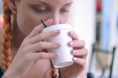 image of young woman drinking a cup of tea