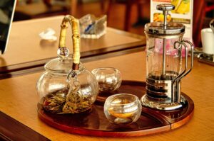 Image of tea set up on tray with glass teapot
